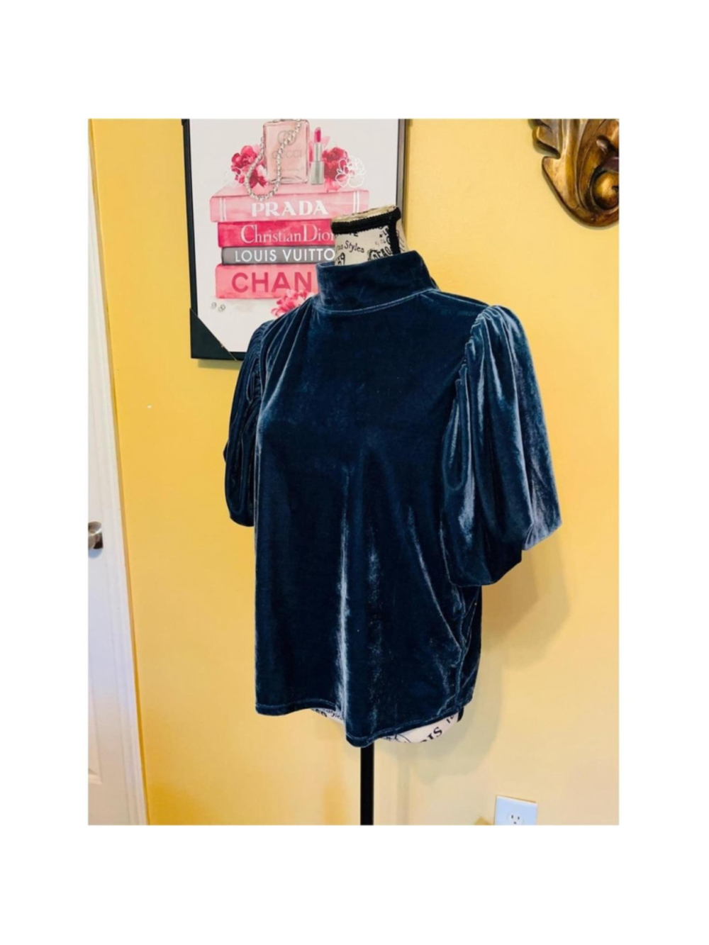 Elevate your wardrobe with the Free People Navy Velvet Mock Neck Puff Sleeve Top